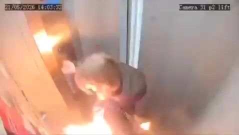 A portable charger explodes inside an elevator, leaving a woman trapped in the flames