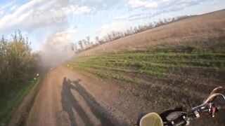 A Ukrainian drone strikes a moving vehicle carrying russian soldiers