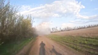 A Ukrainian drone strikes a moving vehicle carrying russian soldiers