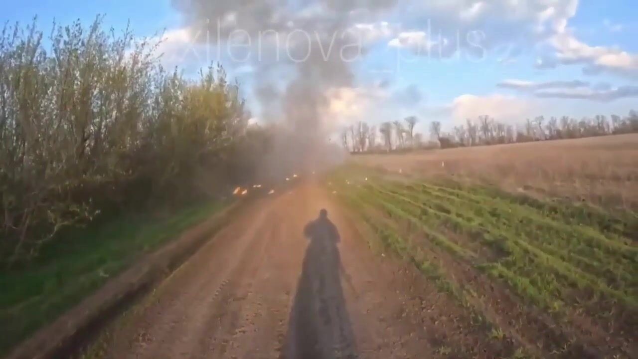 A Ukrainian drone strikes a moving vehicle carrying russian soldiers