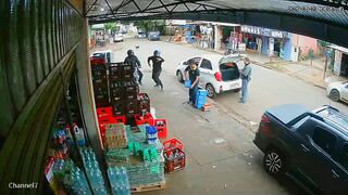 Two Armed Robbers Shot by Police Who Suddenly Appeared During Street Assault