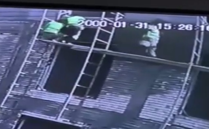 A Tragic Accident in Iraq: Young Workers Fall from High Scaffold