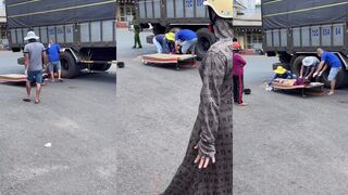 Woman dies after legs crushed by work truck