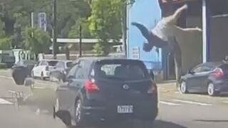 Driver Running On Red Light Sends Rider Flying High