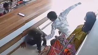 Man Brutally Assaults Girlfriend With Slaps, Punches and Kicks Inside Clothing Store