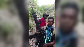 Haitian Gang Members Showing Police Officers They Ambushed And Killed In The Woods
