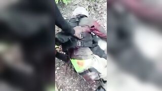 Haitian Gang Members Showing Police Officers They Ambushed And Killed In The Woods