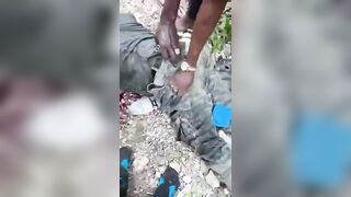 Haitian Gang Members Showing Police Officers They Ambushed And Killed In The Woods