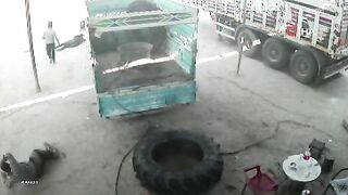 Truck Tire Explodes Like a Bomb, Hurling Two Men Across Workshop