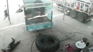 Truck Tire Explodes Like a Bomb, Hurling Two Men Across Workshop
