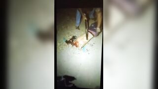 Corpse being dismembered with a machete.