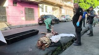 Dismembered corpse in the middle of the street