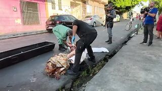 Dismembered corpse in the middle of the street