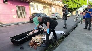 Dismembered corpse in the middle of the street