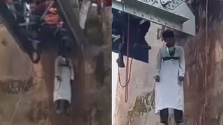 Man in White Robe Found Dead Hanging from Railway Bridge  in Indonesia
