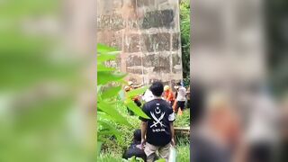 Man in White Robe Found Dead Hanging from Railway Bridge  in Indonesia