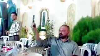 Classic: Idiotic dad gives his son a gun during a celebration