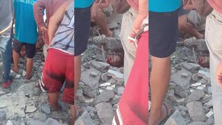 Building collapse burying man in the Philippines