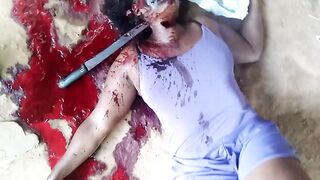 Murdered with a machete stuck in her neck