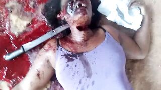 Murdered with a machete stuck in her neck
