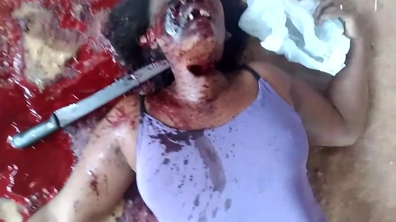 Murdered with a machete stuck in her neck
