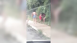 Women fighting in the street