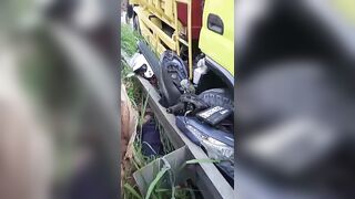 Motorcyclist Crushed Against Railing Following Collsion With A Truck In Indonesia