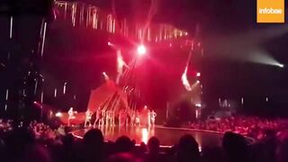 Classic: Performer loses grip during a show