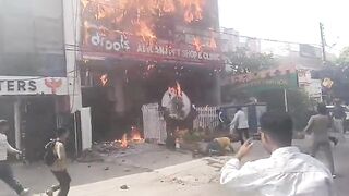 Man Jumps From Burning Building, Lands On Sharp Fencing