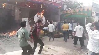 Man Jumps From Burning Building, Lands On Sharp Fencing