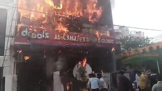 Man Jumps From Burning Building, Lands On Sharp Fencing
