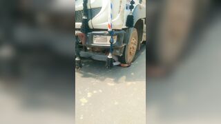 Old Man`s Head Flattened By The Truck Wheel