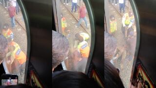 Man dragged out from under train