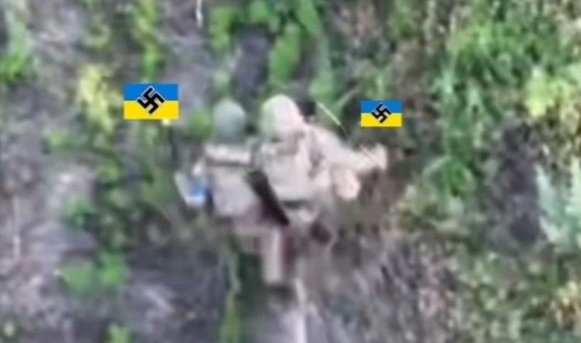 Brave Ukrainian carries his wounded friend.