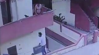 Man Falls From Balcony While Trying to Grab Ice Cream From Street Vendor