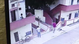 Man Falls From Balcony While Trying to Grab Ice Cream From Street Vendor