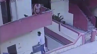 Man Falls From Balcony While Trying to Grab Ice Cream From Street Vendor
