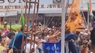 A performer accidentally catching fire during a fire-spitting stunt