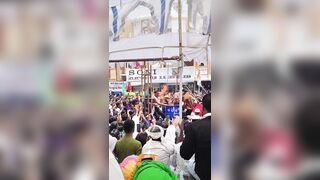 A performer accidentally catching fire during a fire-spitting stunt