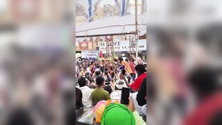 A performer accidentally catching fire during a fire-spitting stunt