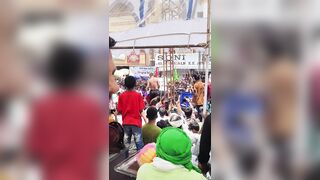 A performer accidentally catching fire during a fire-spitting stunt