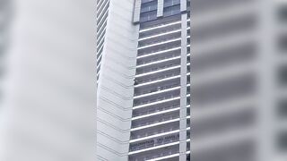 Person Jumps From A Tall Residental Building In  in Makati, Philippines