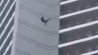 Person Jumps From A Tall Residental Building In  in Makati, Philippines