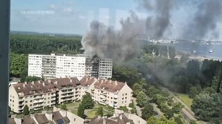 Man seen climbing from balcony during Antwerp fire