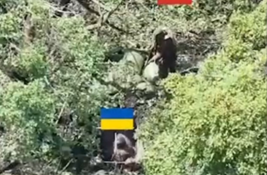 Russian shoots Ukrainian in the neck.