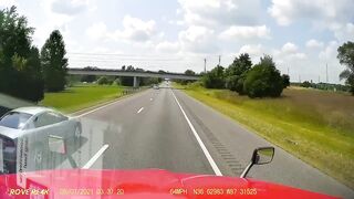Guy commits suicide by jumping off an overpass onto a semi truck