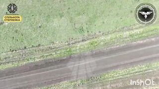 Russian playing dead gets his CAP PEELED by Ukranian drone.