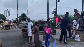 Chicken Thief Tied To The Pole In The Middle Of The Road In Nigeria