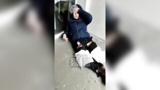 Ukr Nazi woman crying over her foot.