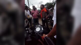 Man Seen Dragging Woman Clinging To His Motorcycle
